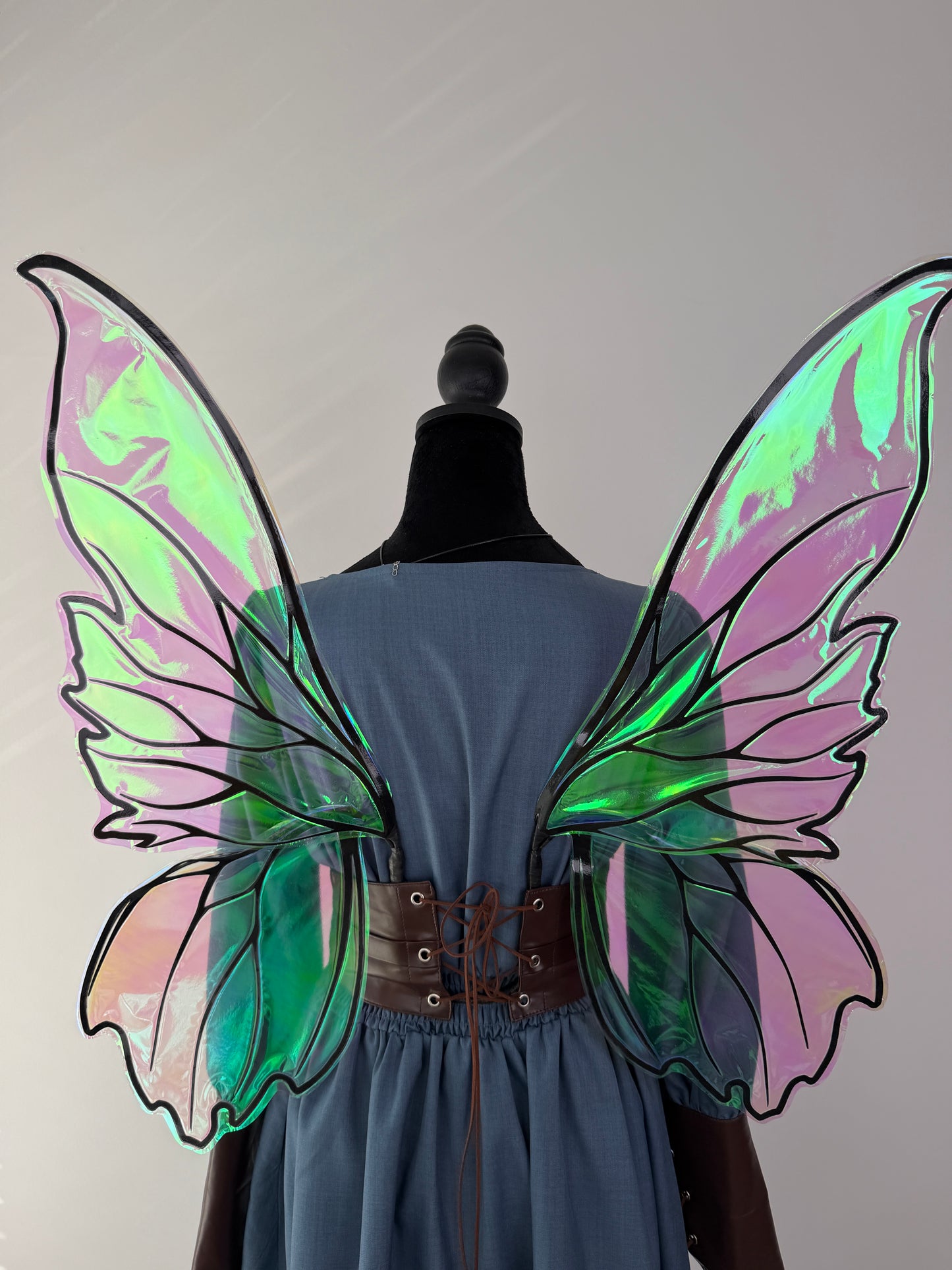 Woodland fairy wings styled with a corset and flowing blue fantasy dress
