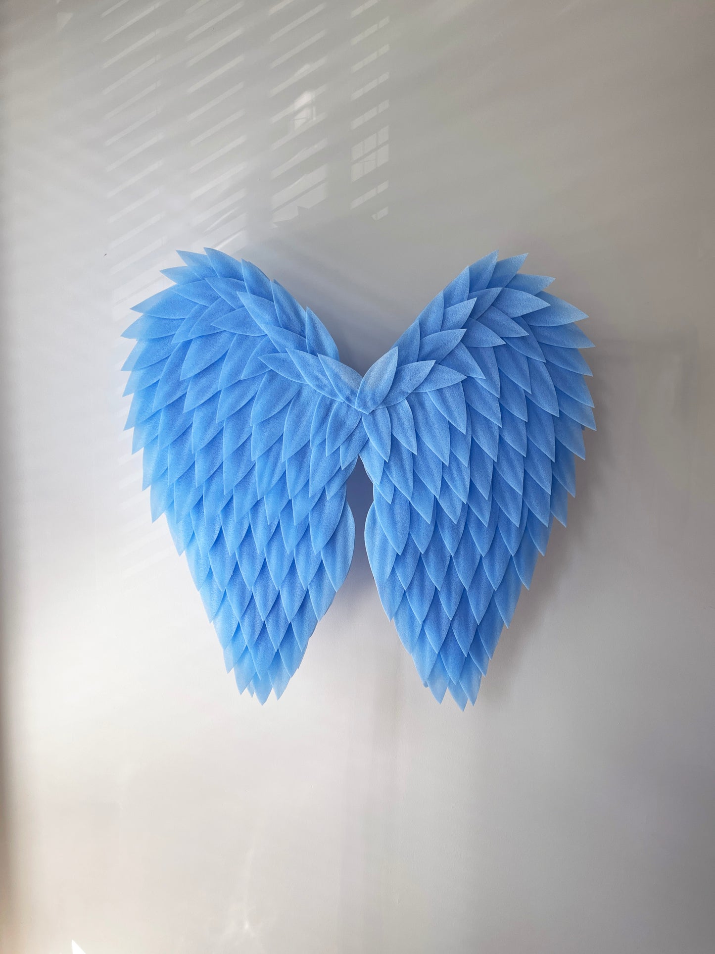 Blue angel wings on a white background