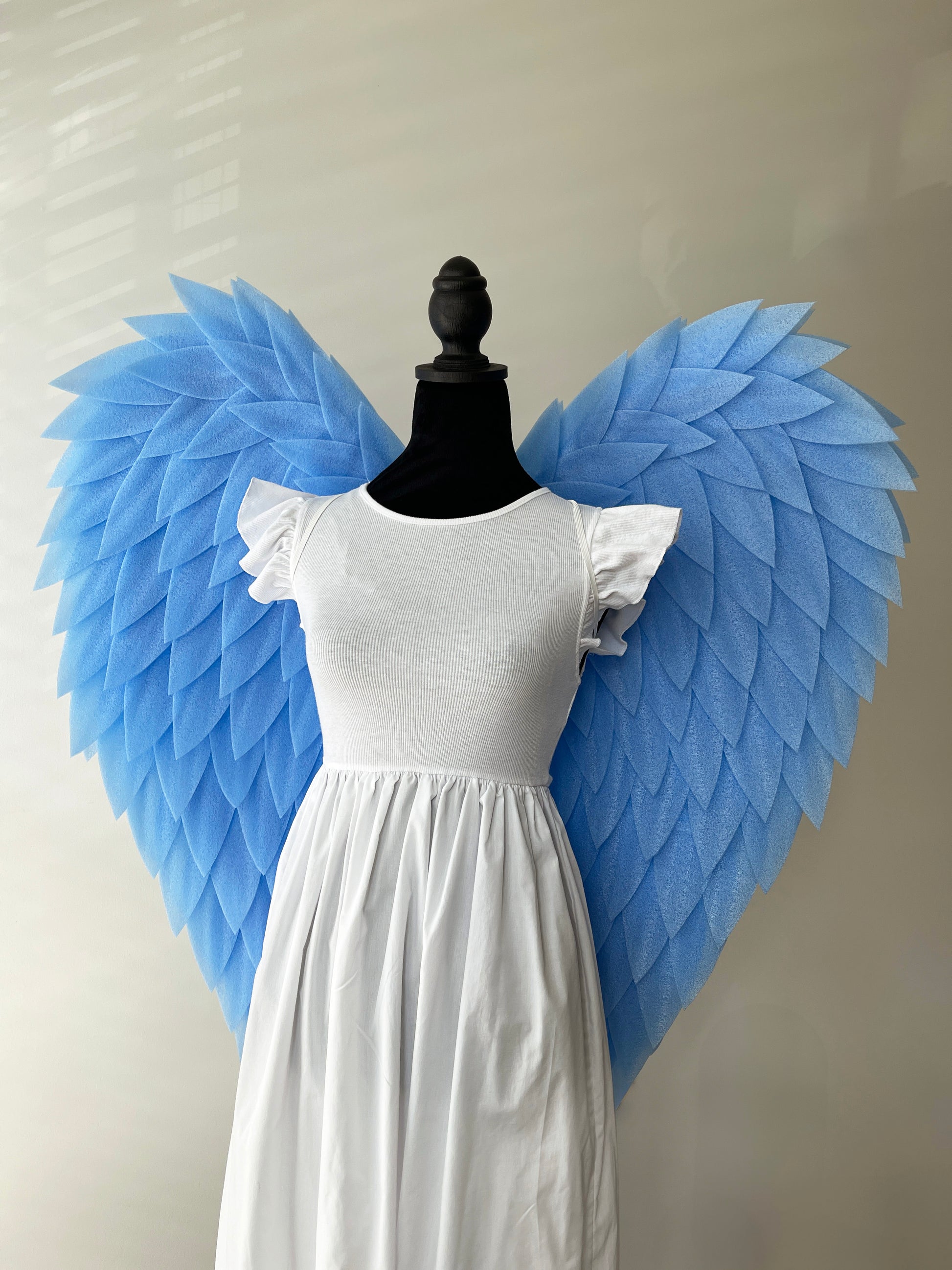 Handcrafted blue angel wings with layered feathers