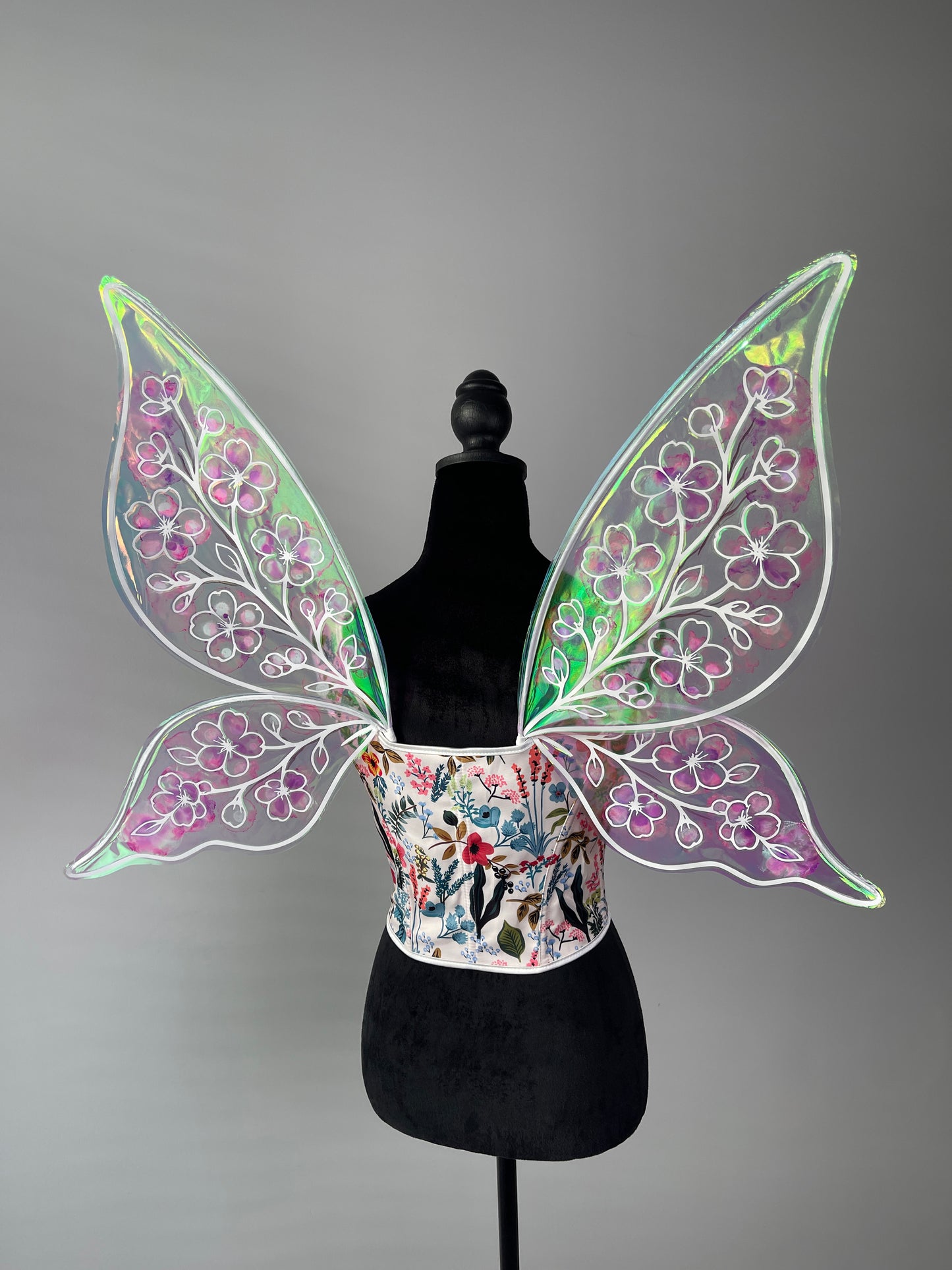 Handmade iridescent wings reflecting rainbow light