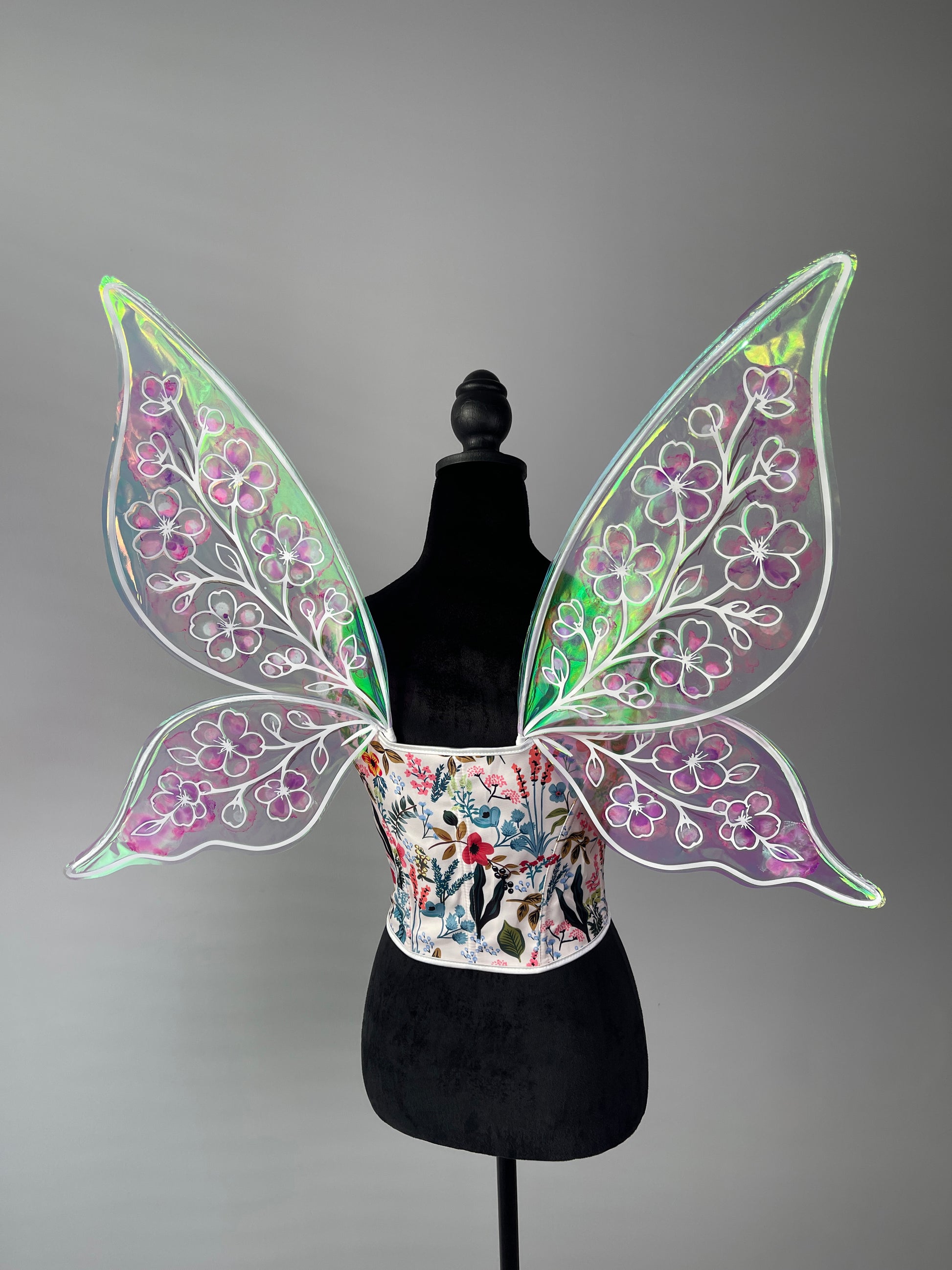 Handmade iridescent wings reflecting rainbow light