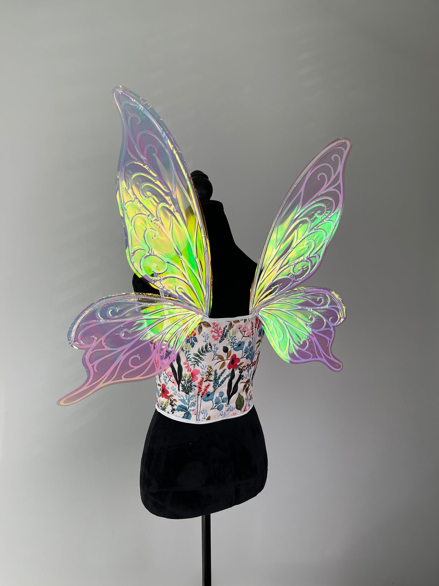 Iridescent fairy wings fluttering in natural light