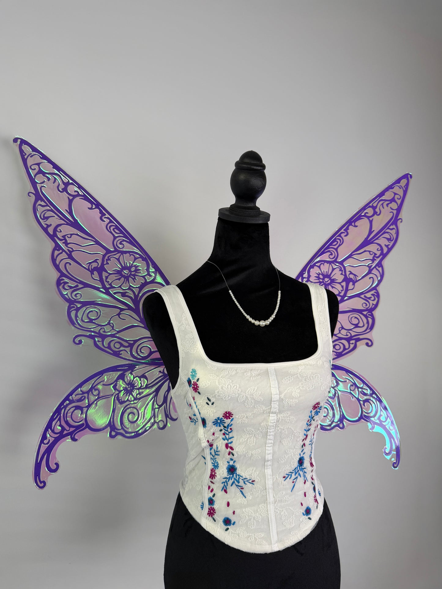 Purple fairy wings with green light reflection