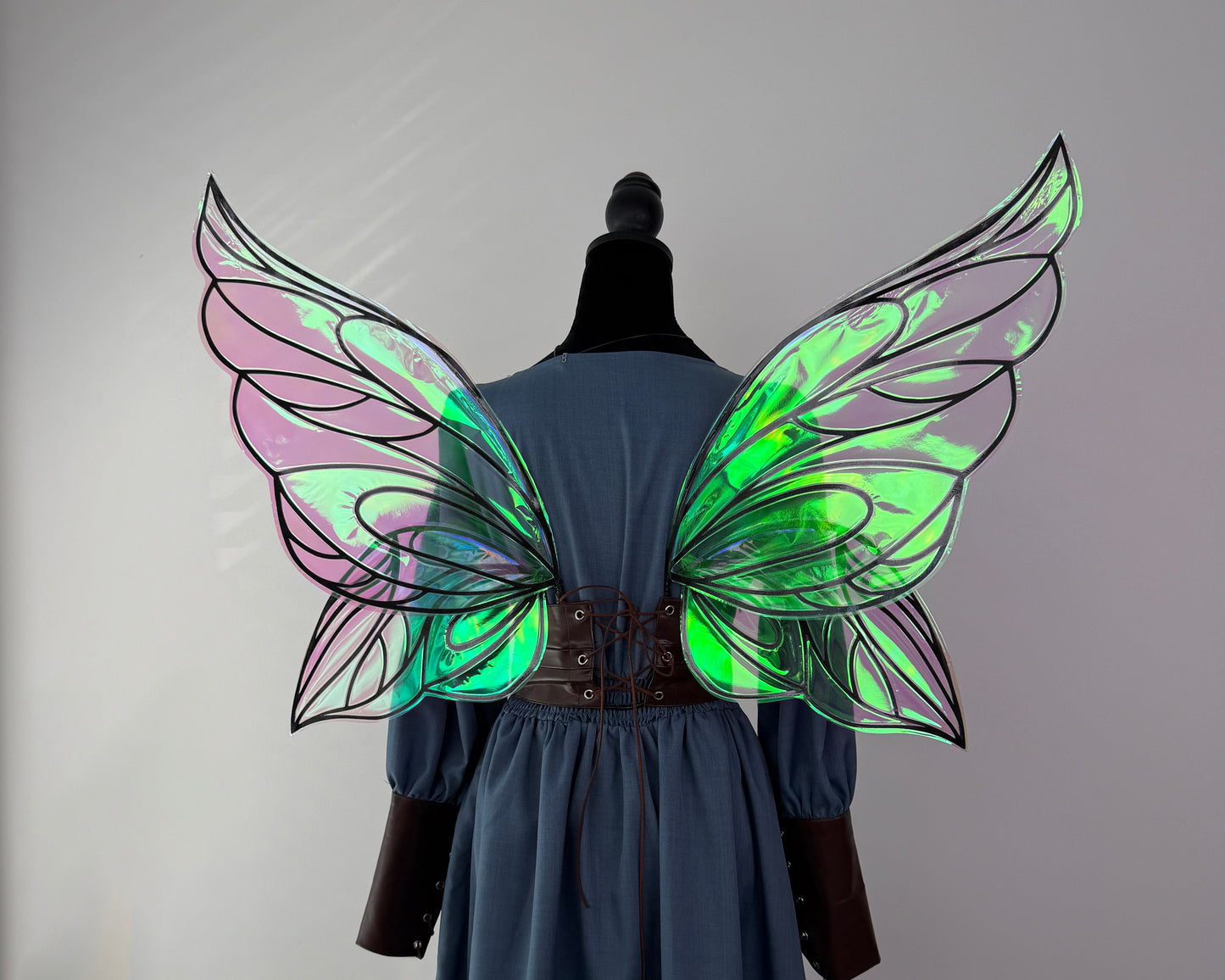 Dark fae costume wings with pointed tips, dramatic outlines and a magical reflective finish