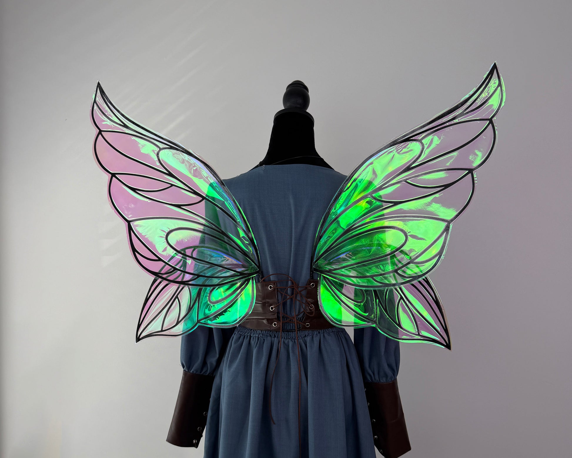 Dark fae costume wings with pointed tips, dramatic outlines and a magical reflective finish