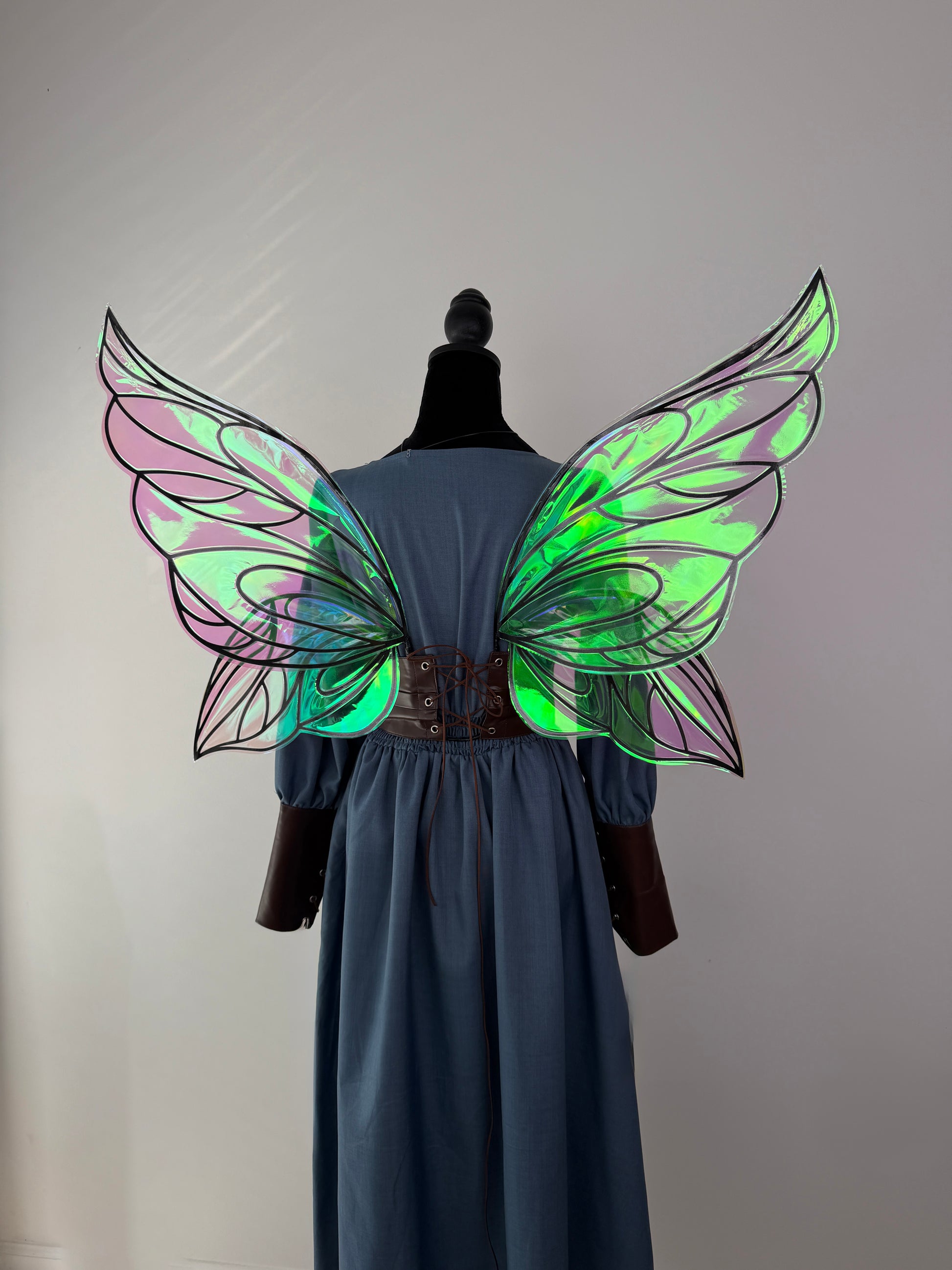 Enchanted forest fairy wings for adults with shimmering emerald and violet reflections