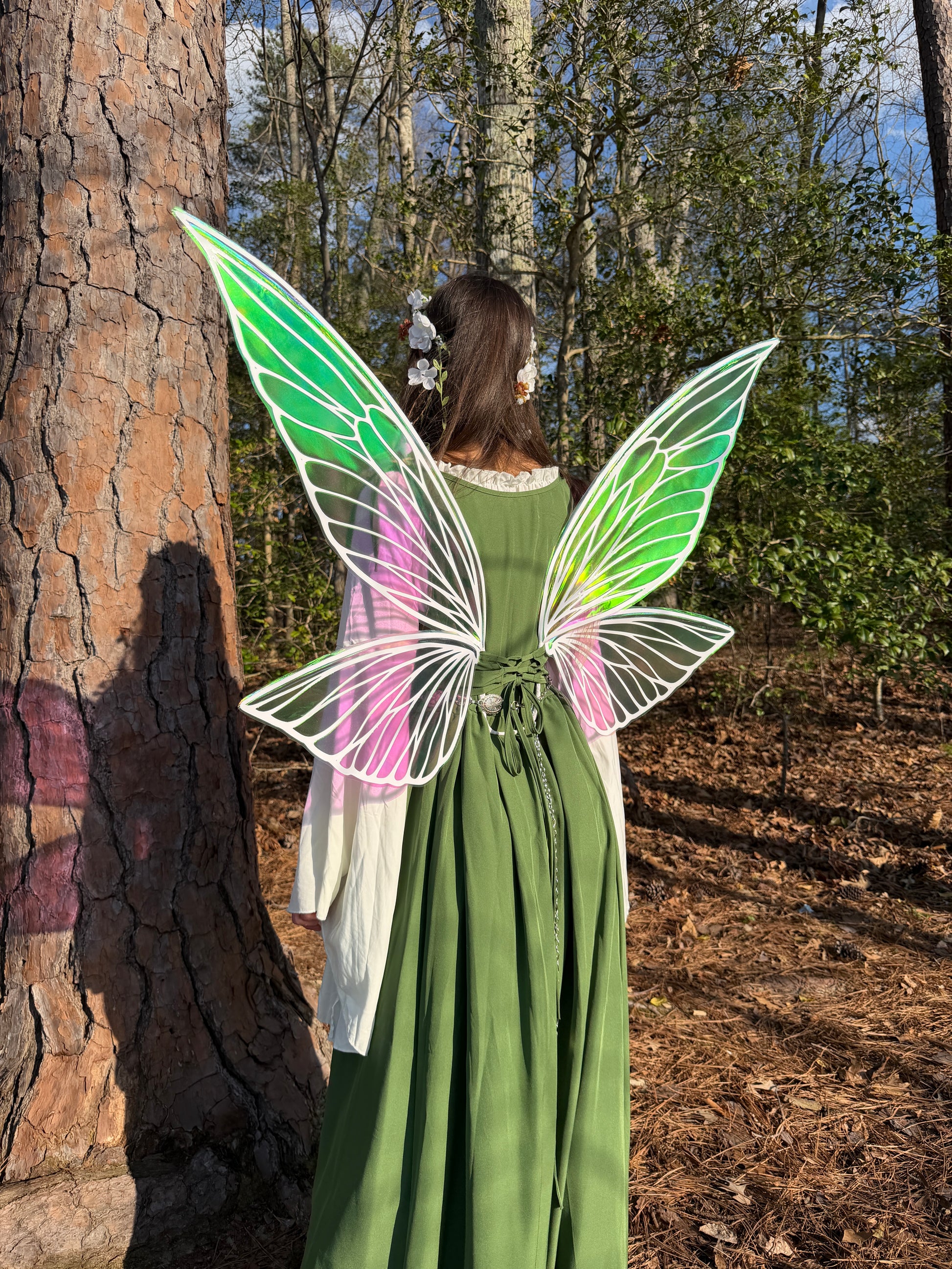 Back view of iridescent butterfly fairy wings worn with fantasy dress