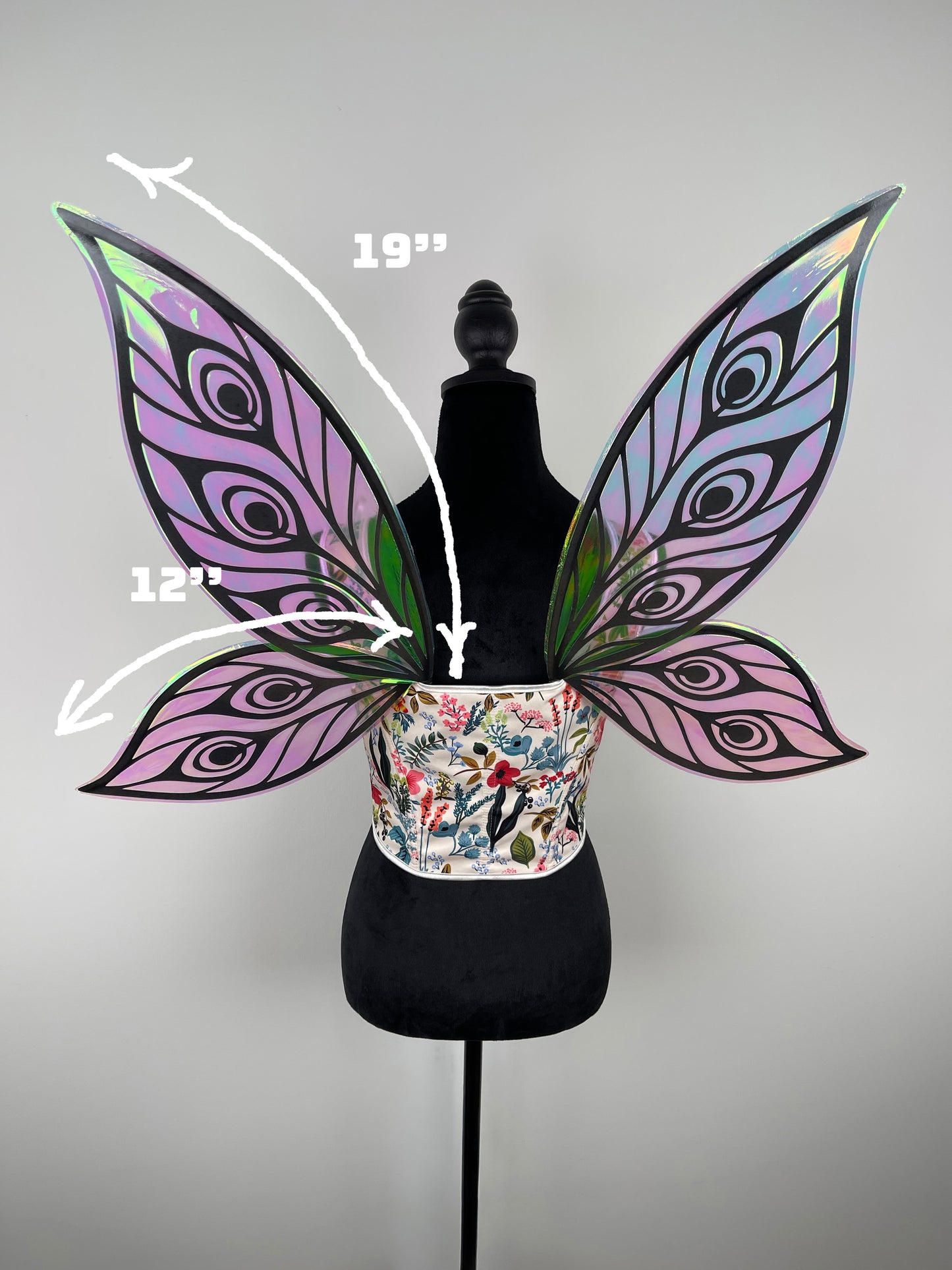 Butterfly wings on a mannequin with measurements indicated