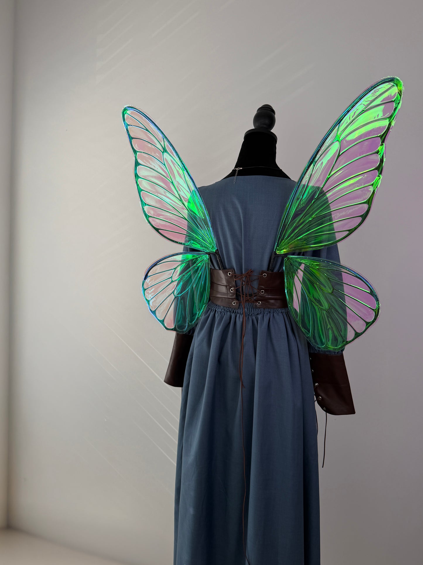 Elegant fairy wings featuring a lace-up corset style attachment for secure wear.