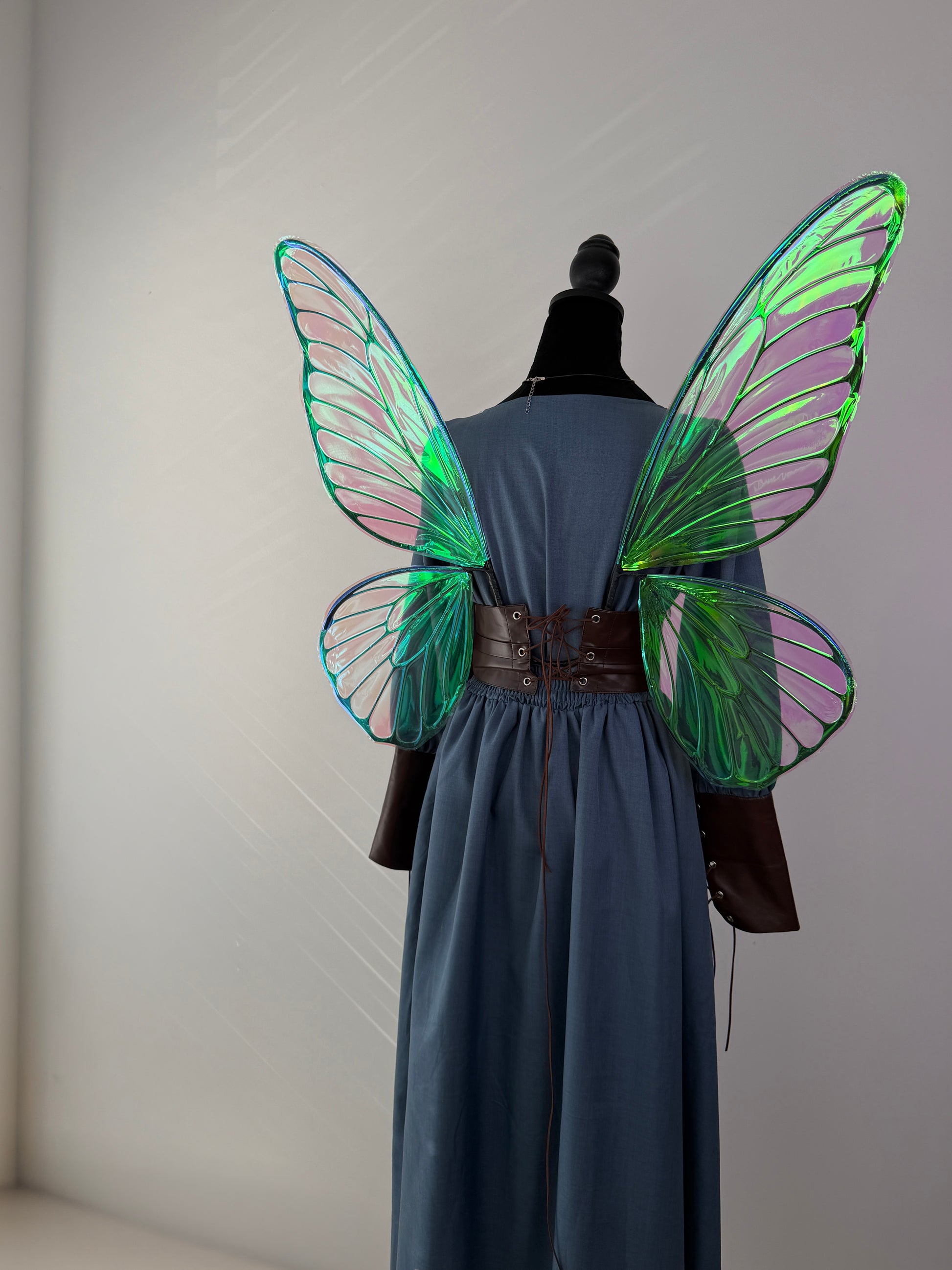 Elegant fairy wings featuring a lace-up corset style attachment for secure wear.
