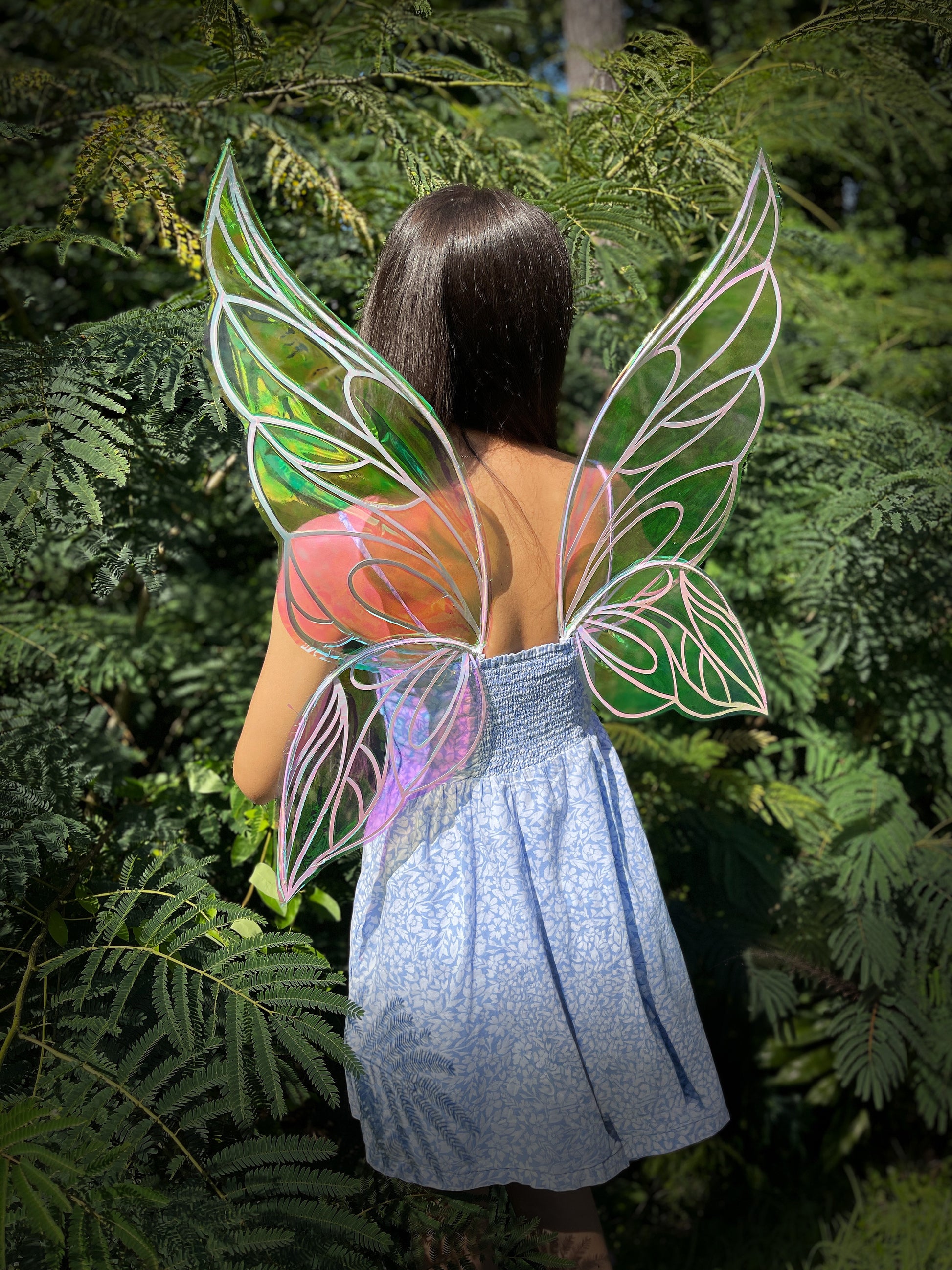 Iridescent fairy butterfly wings worn outdoors in natural light