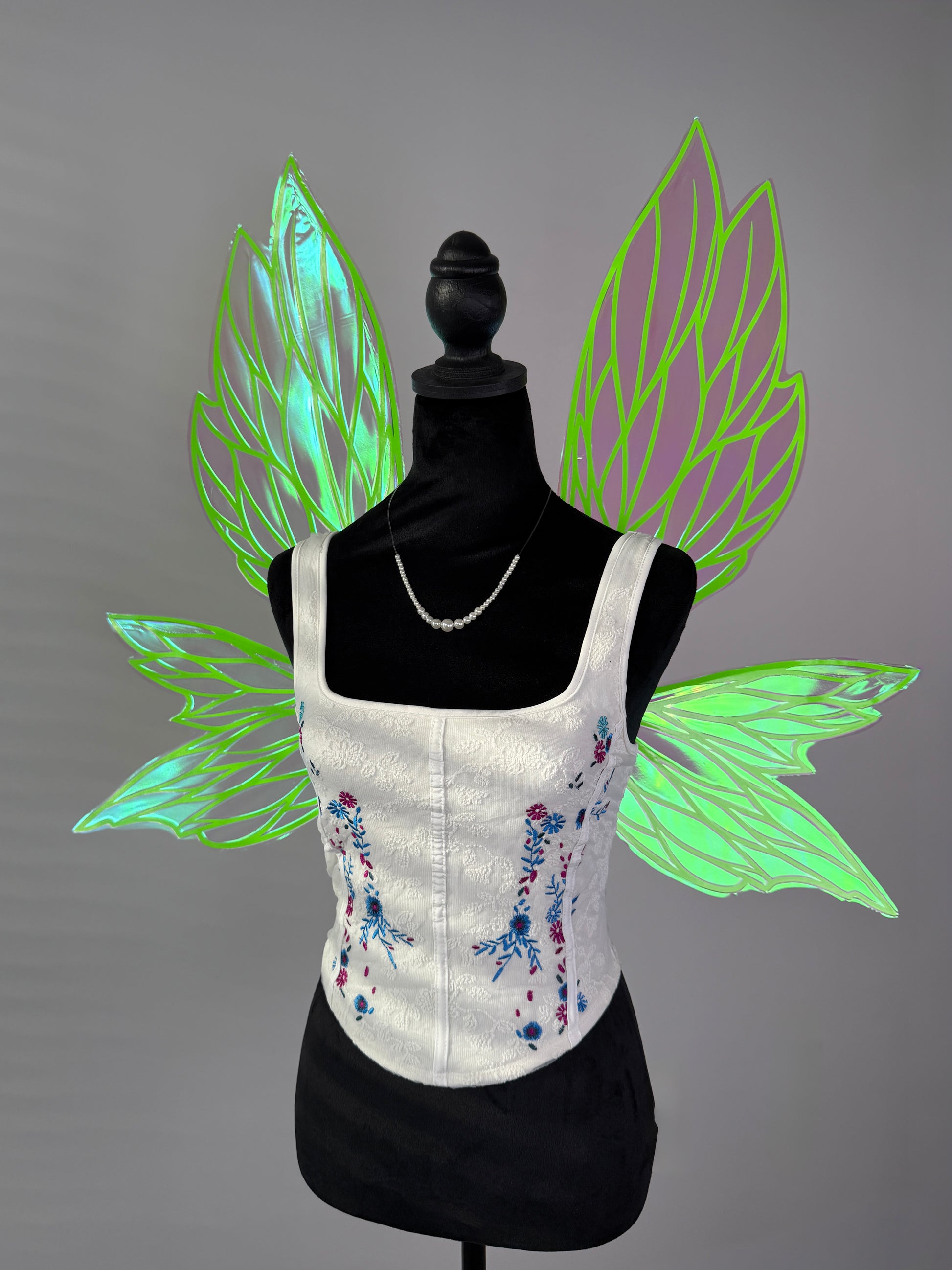 Iridescent fairy wings with neon green veins and transparent leaf design for fantasy costume or cosplay