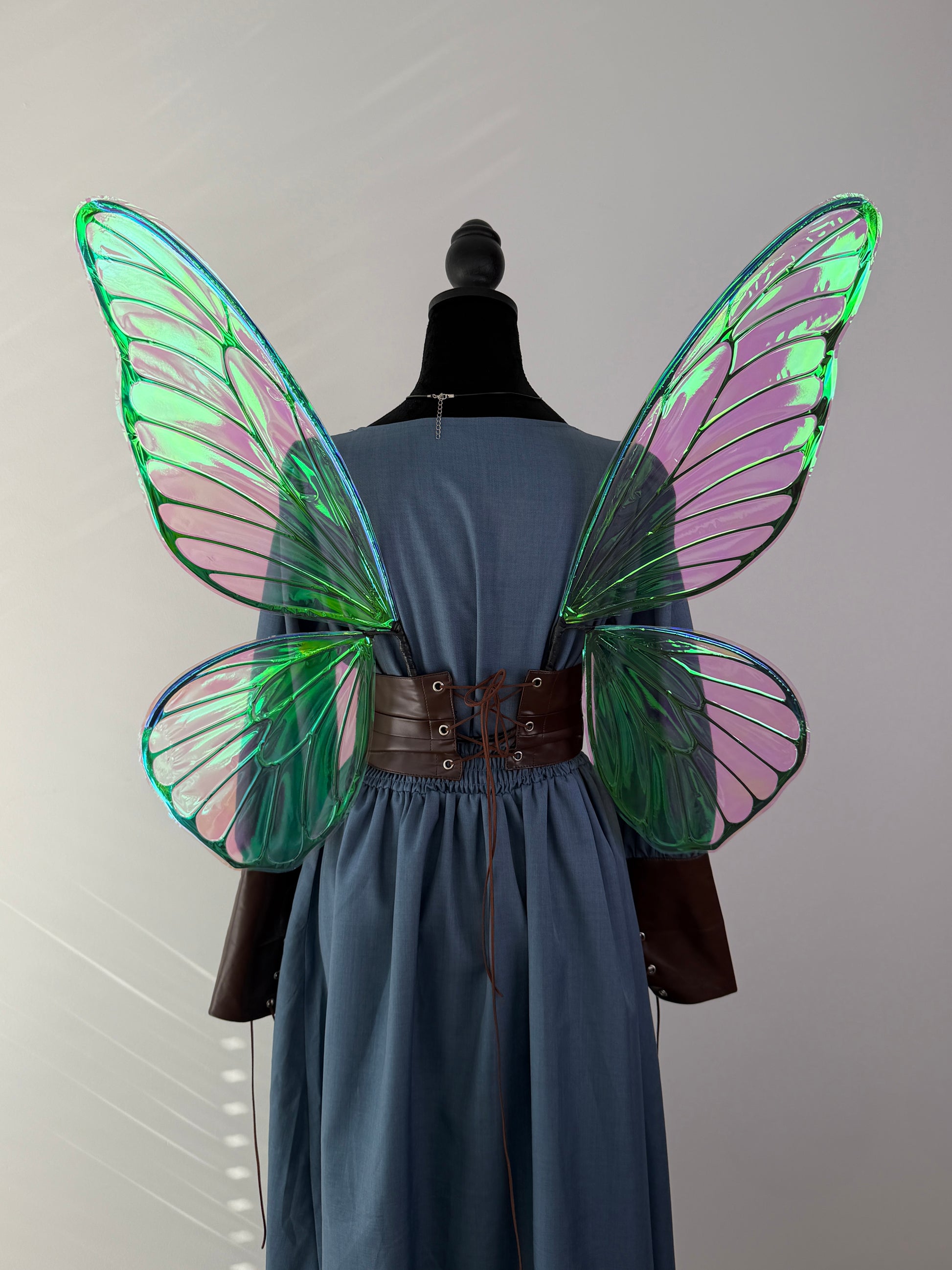 Oversized iridescent butterfly fairy wings designed for cosplay, festivals and fantasy photography.
