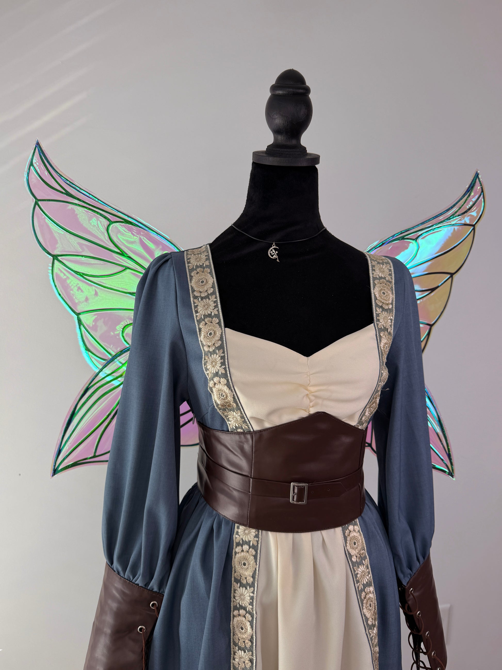 Back view of large iridescent fae wings with an elegant four-wing butterfly shape