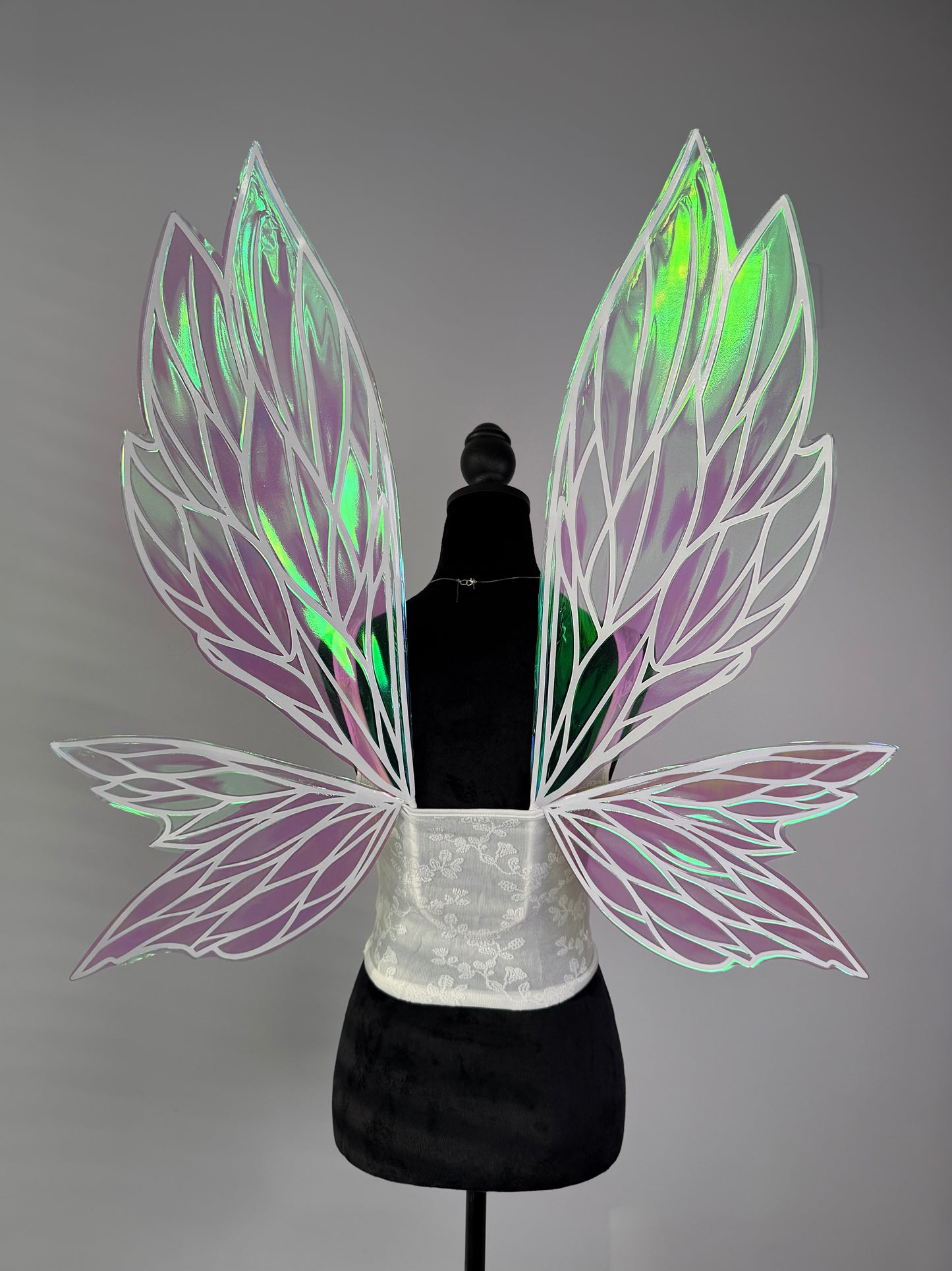 Large fantasy fairy wings in iridescent green and soft pink with elegant leaf pattern