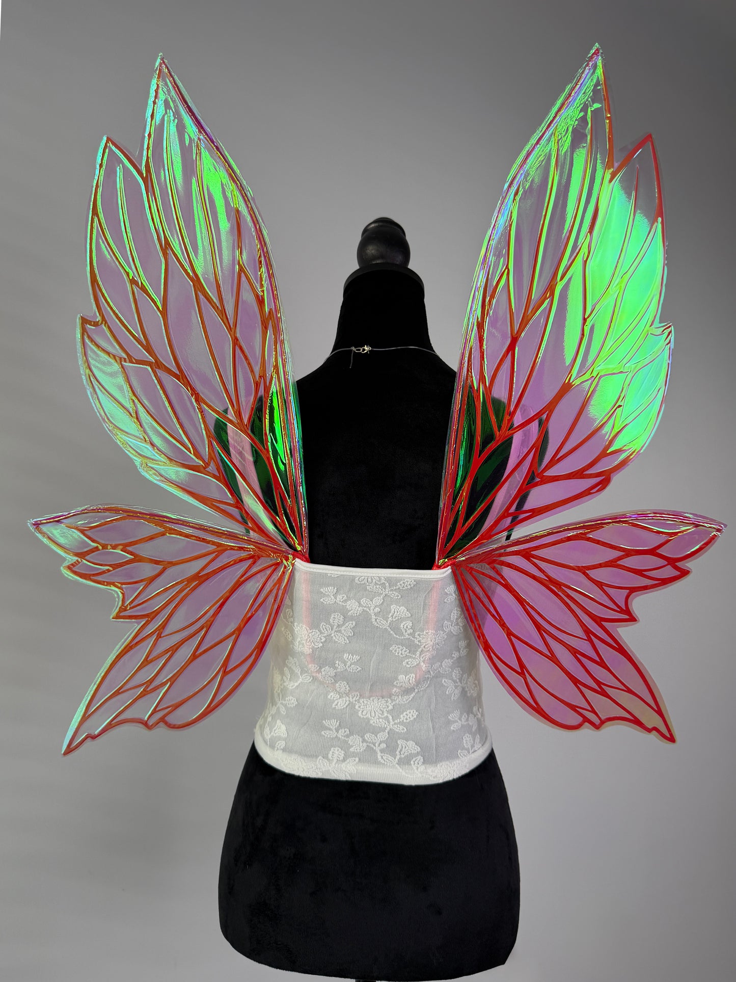 Large iridescent fairy wings with red orange veins and shimmering transparent design for fairy costume