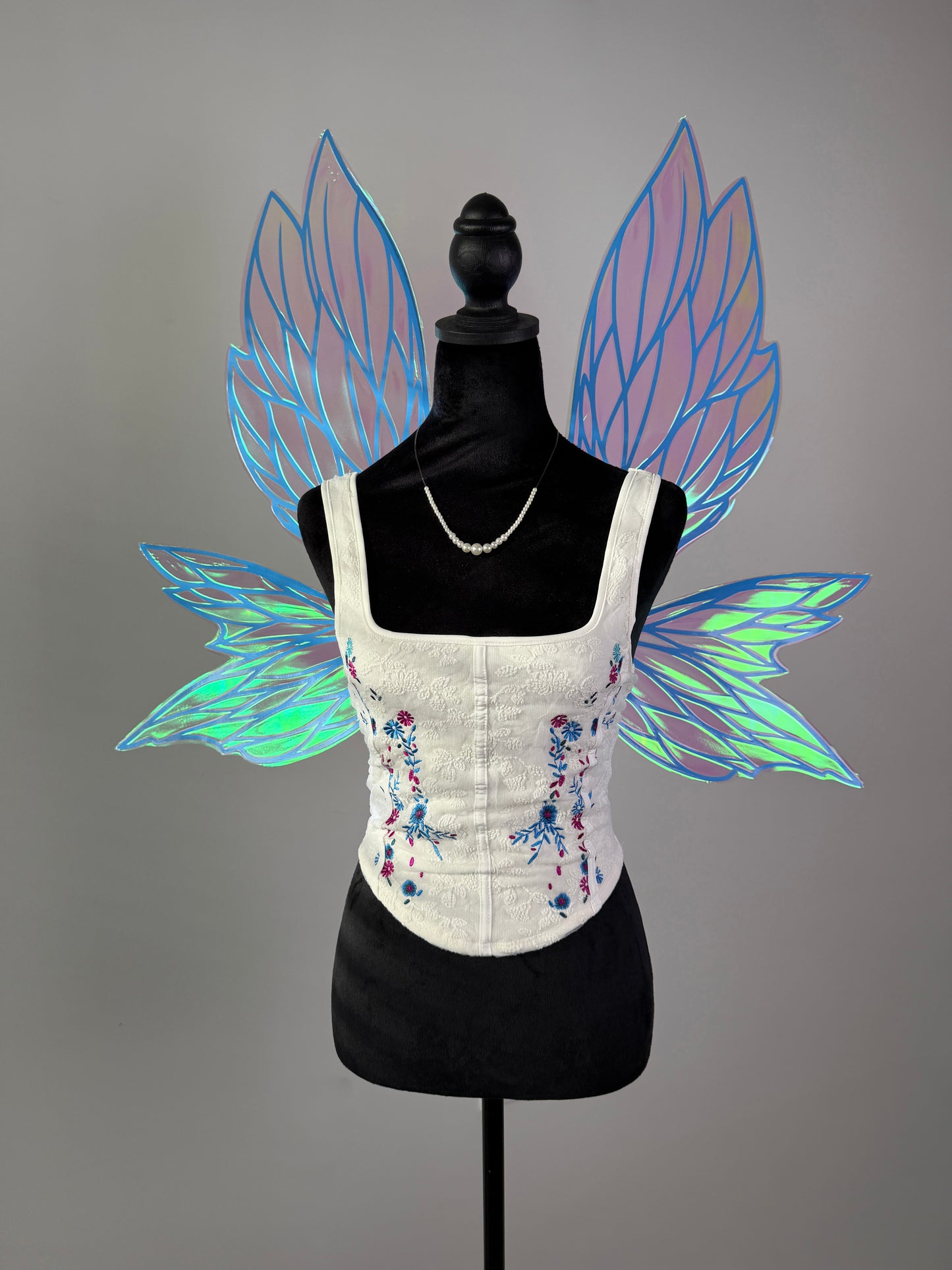 Pink and blue iridescent fairy wings with delicate leaf pattern for fantasy costume accessory