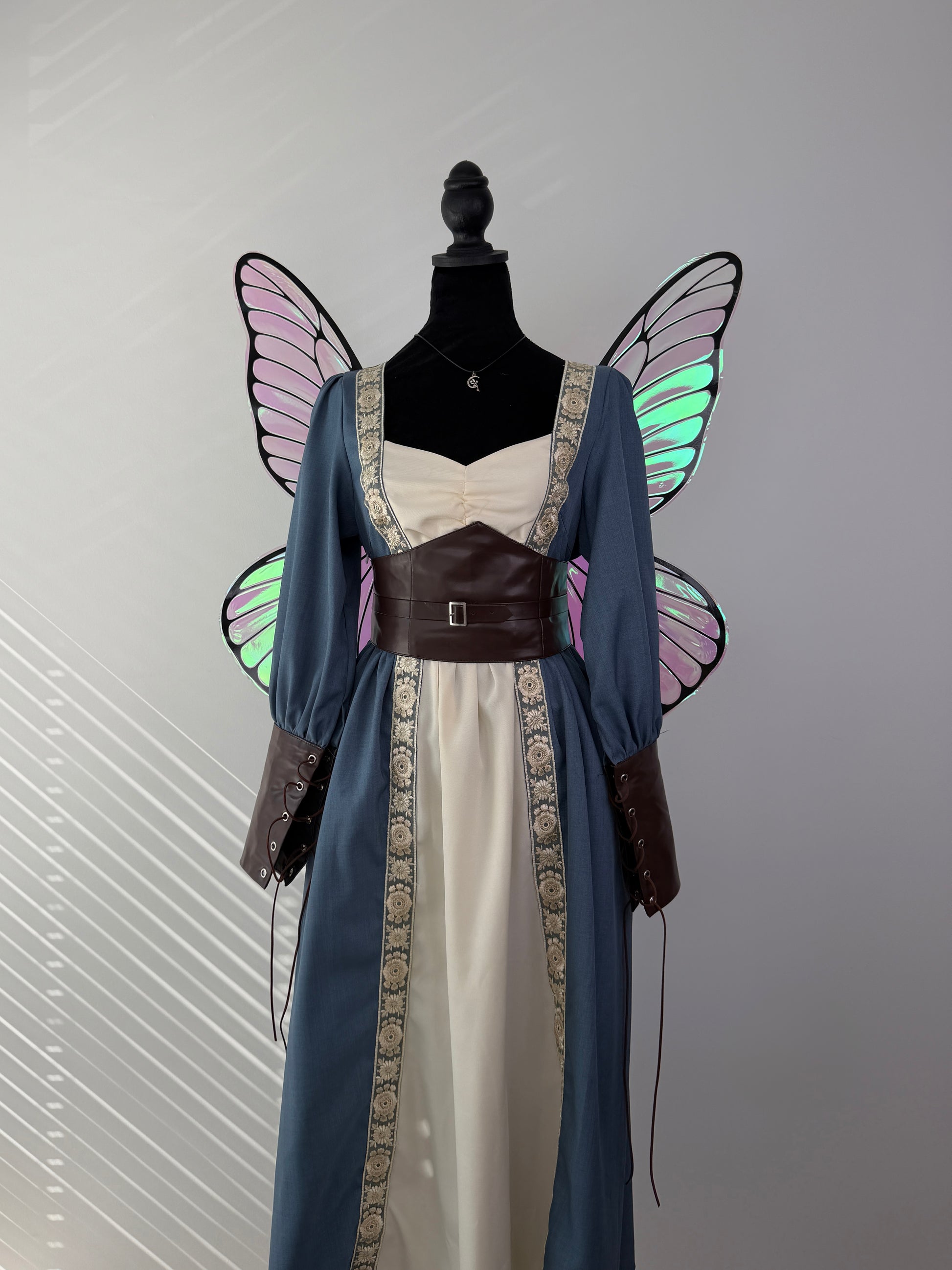 Premium handmade butterfly fairy wings with luminous iridescent finish and lightweight construction.