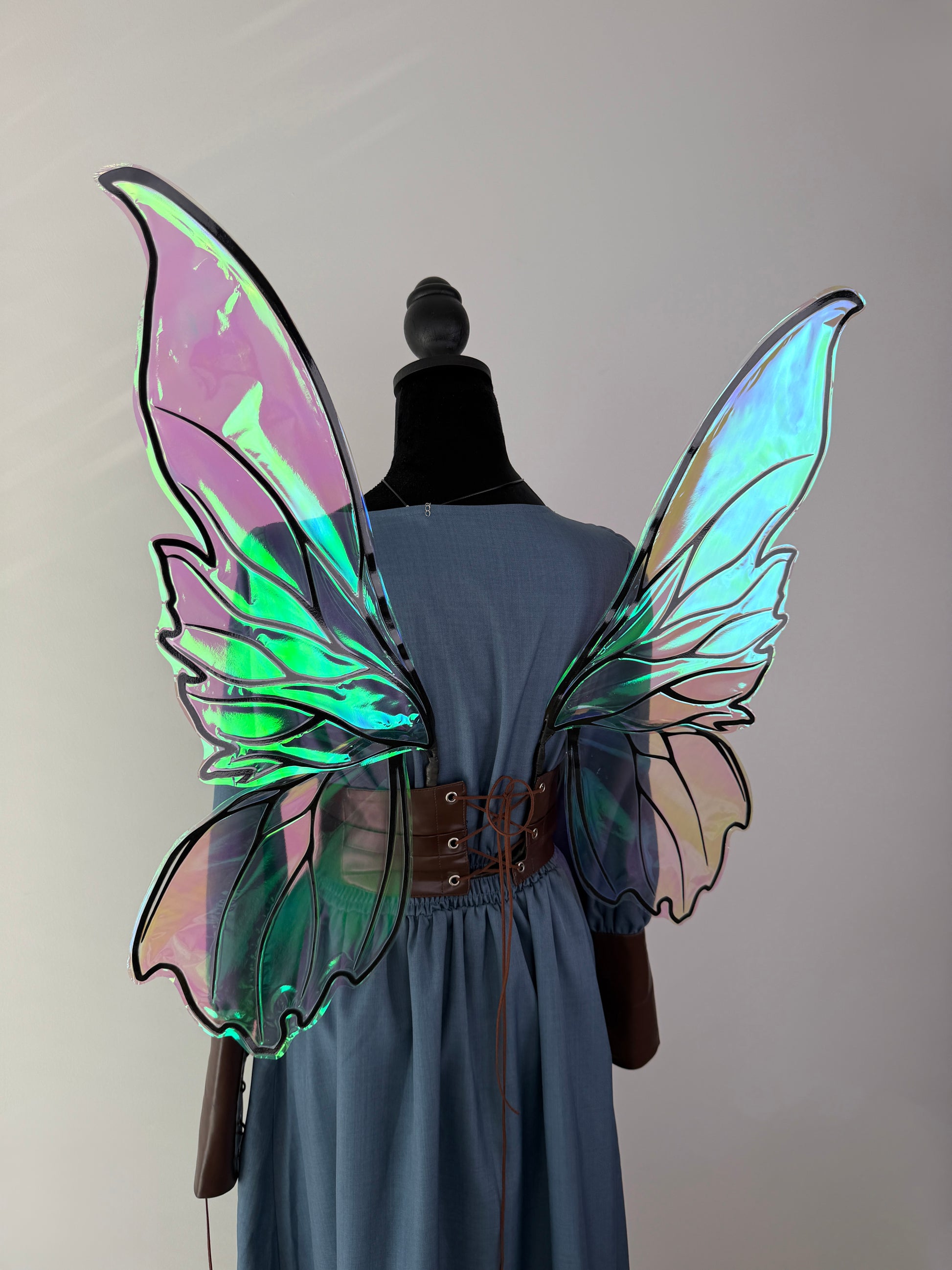 Strapless fairy wings with a U-shape base designed to slide securely beneath a corset